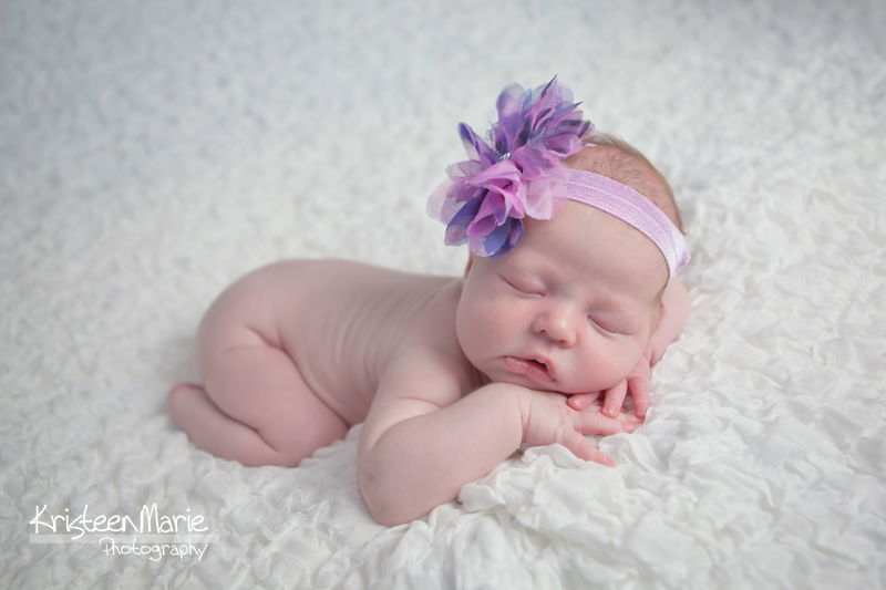 Newborn with purple headband