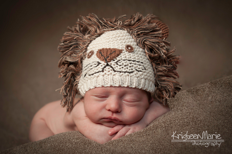 newborn with lion hat