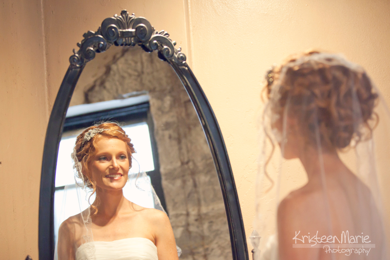 Bride looking in the mirror 