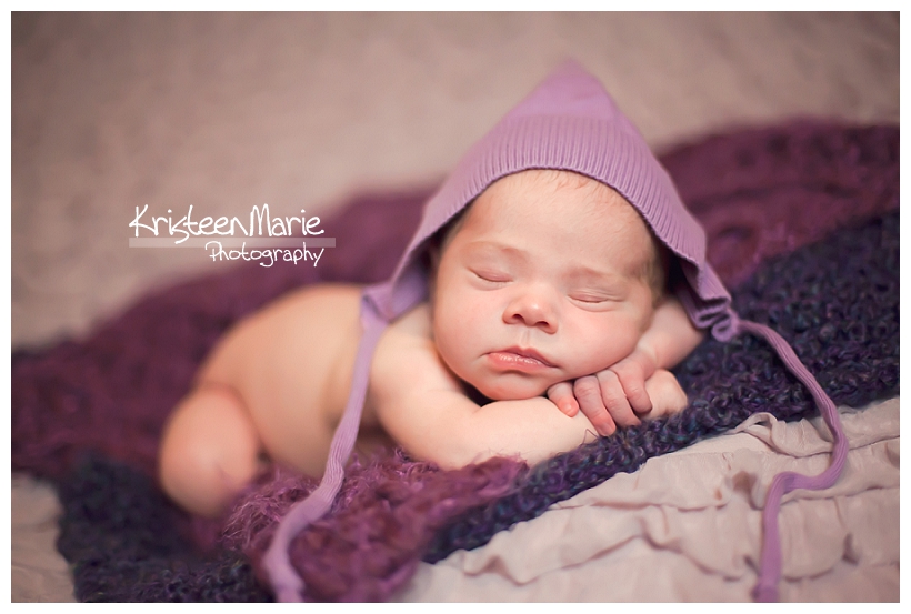 Newborn Baby Girl Dressed in Purple