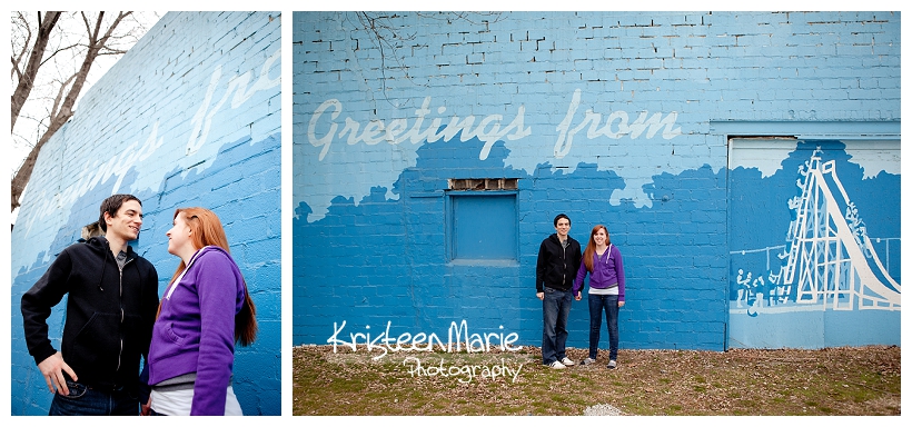 Couple against blue brick wall for engagemnet