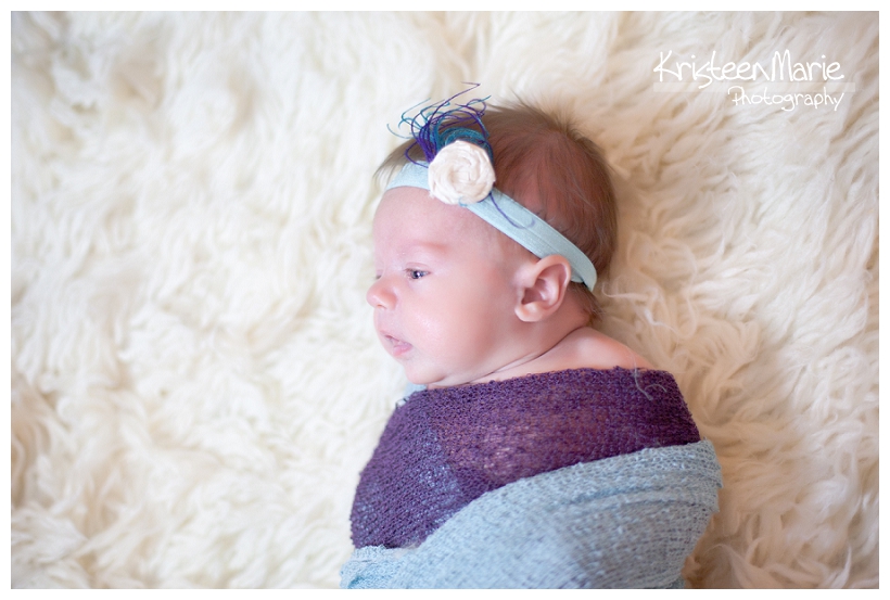 Baby in purple and teal
