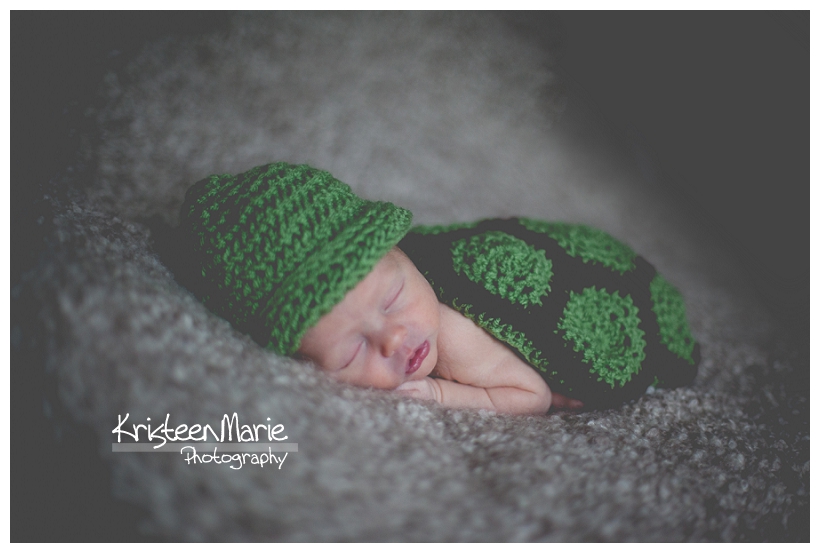 Newborn Baby in knit turtle outfit