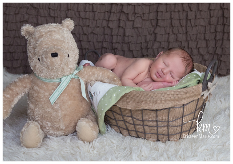 newborn with Pooh Bear