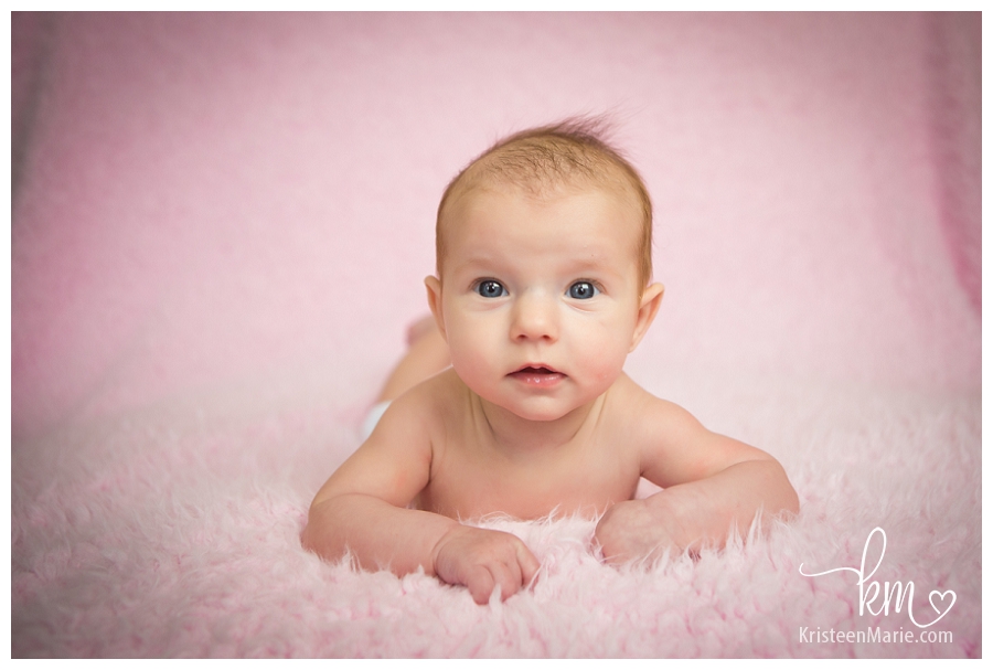 Little girl on pink background