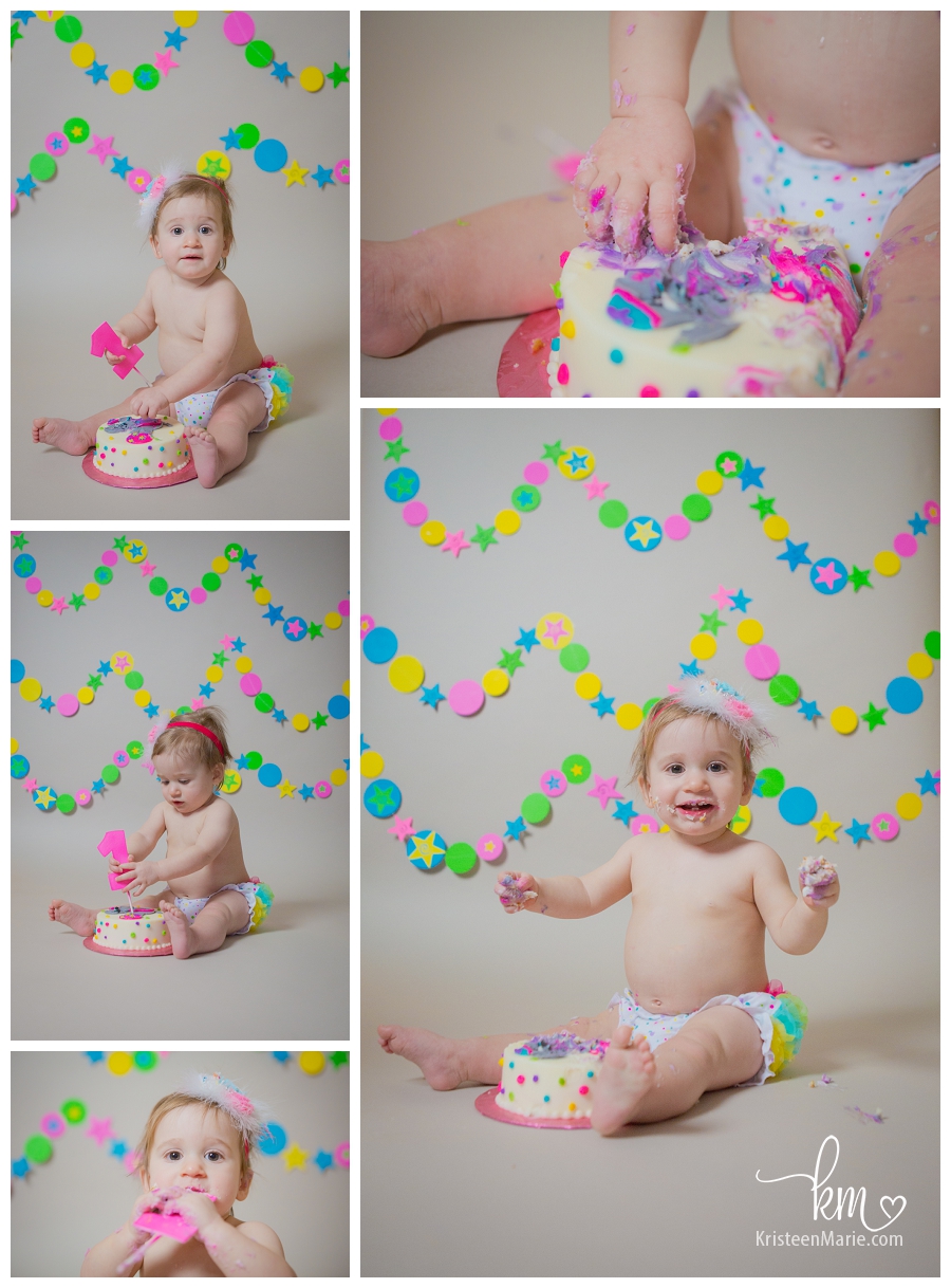 happy one year old eating cake