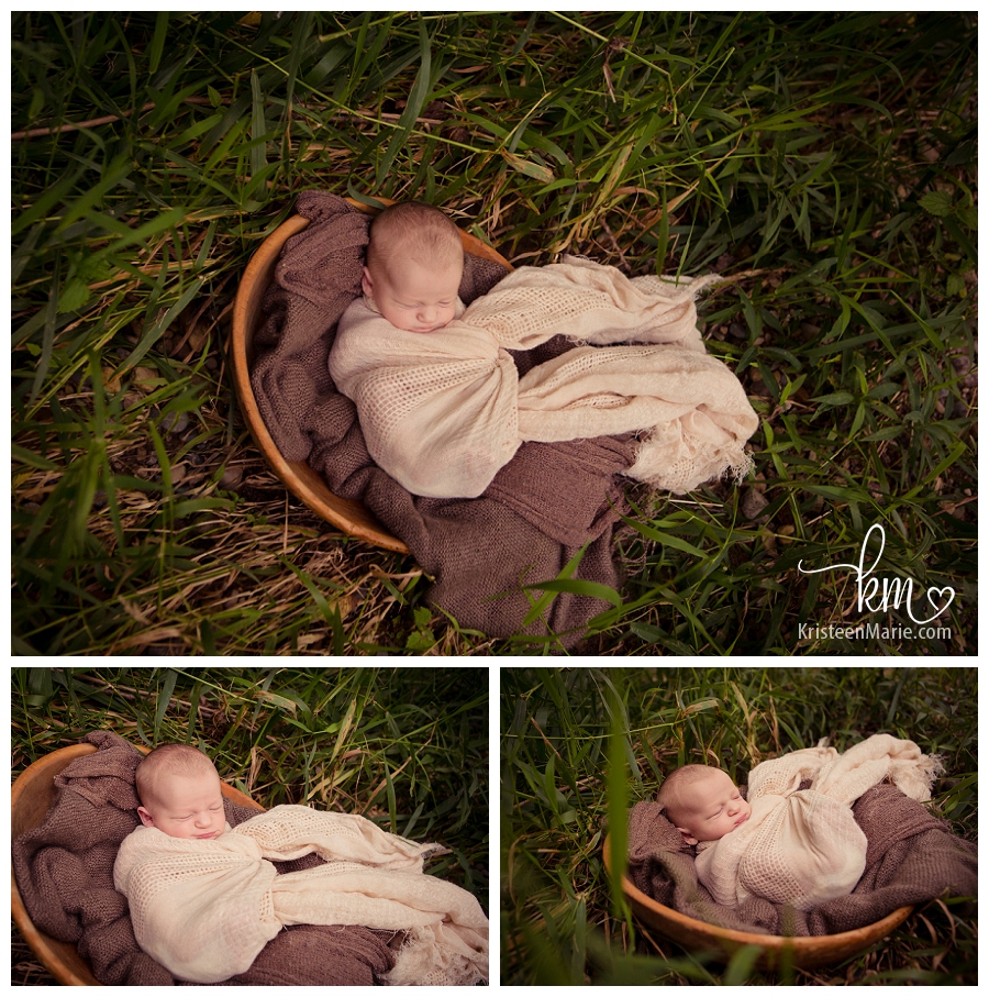 baby sleeping in tall grass outside - Indianapolis newborn photography