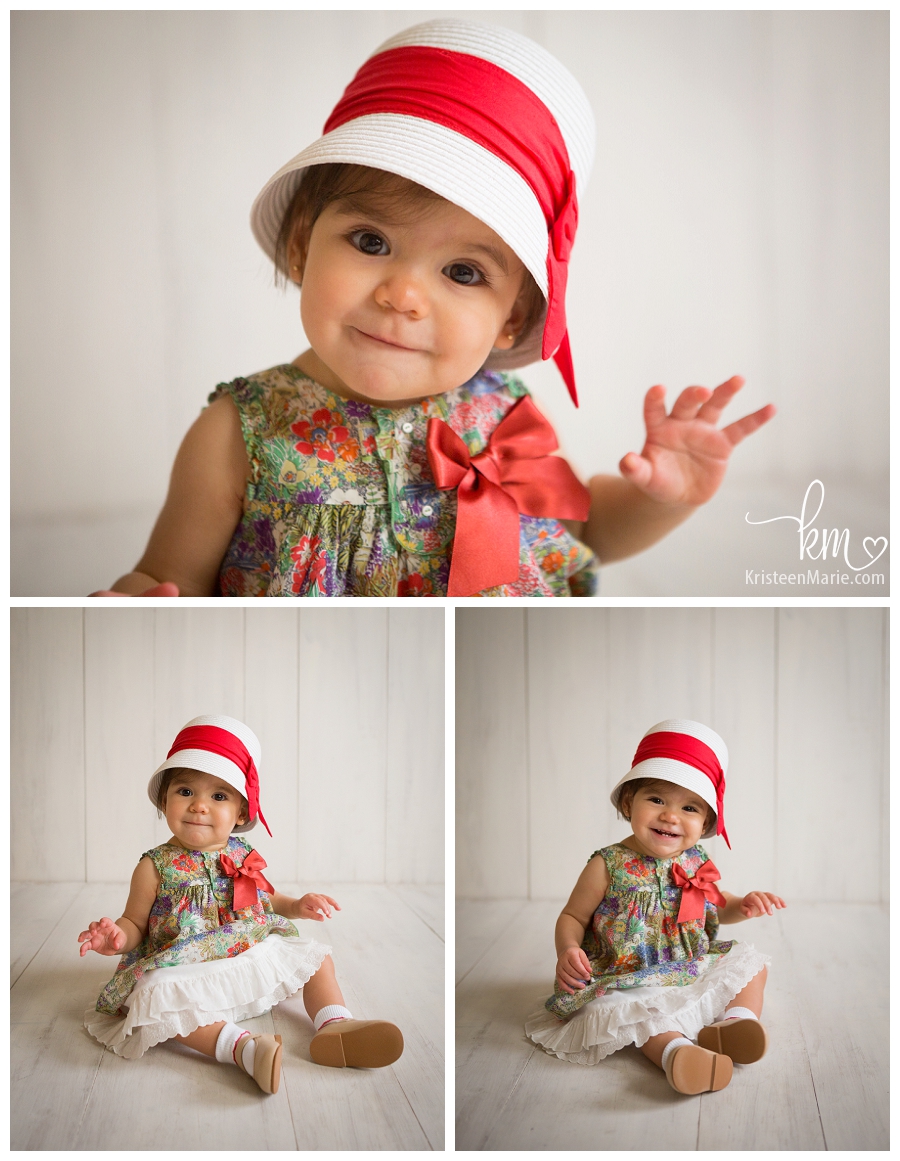 one year old girl in red and green