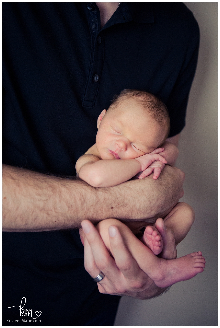 newborn in Dad's hands
