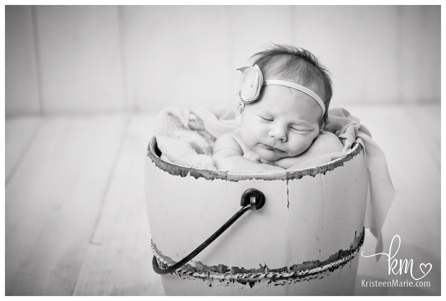 black and white baby in a bucket