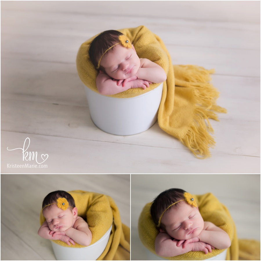 baby in a basket - yellow and cream