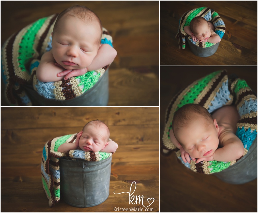 adorable baby boy in a bucket