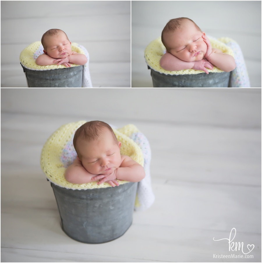 baby in a bucket
