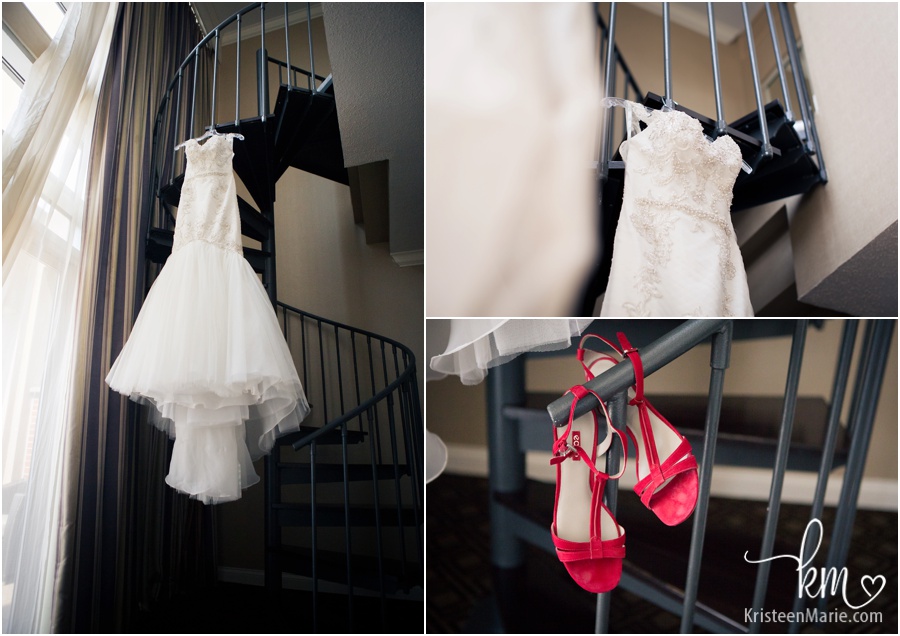 Wedding dress hanging in Omni Severin Hotel room