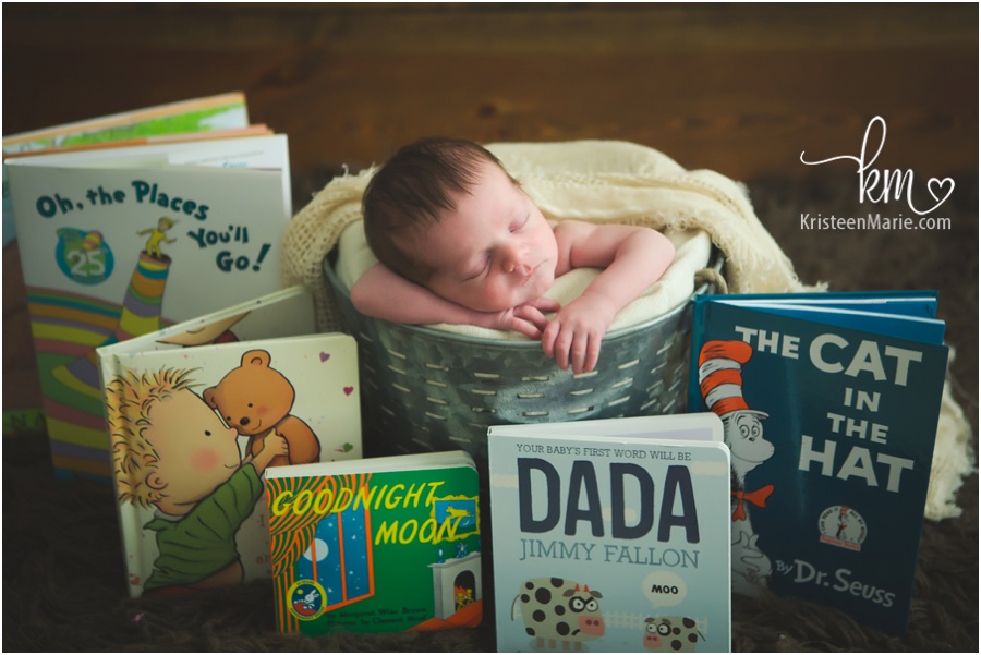 newborn baby with baby books
