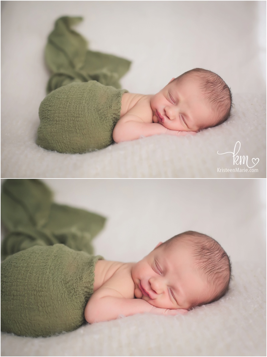 smiling newborn baby boy in green and cream