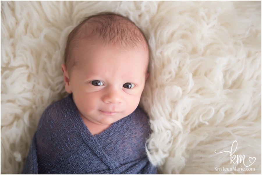 awake newborn baby boy smiling! Great shot by KristeenMarie Photography in Indianapolis, IN