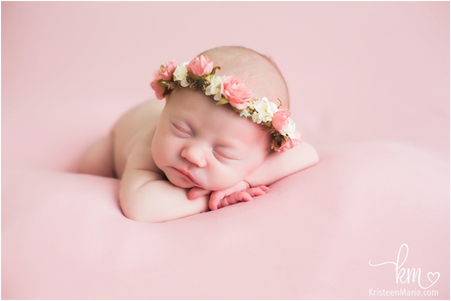 newborn baby girl with flower halo 