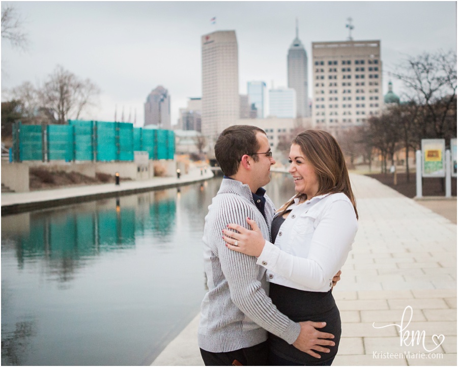 couple laughing after proposal in downtown Indianapolis on canal