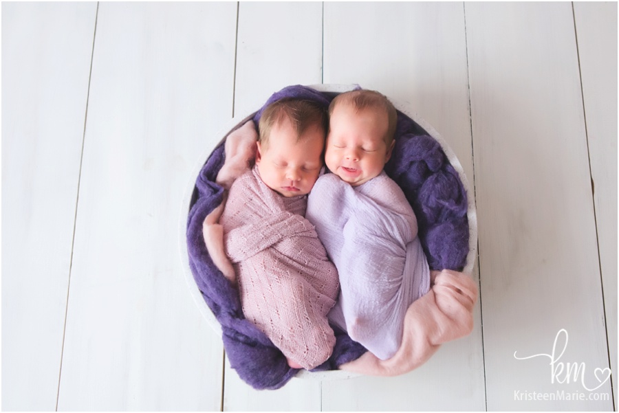 Sleeping newborn baby girls - purple and blush