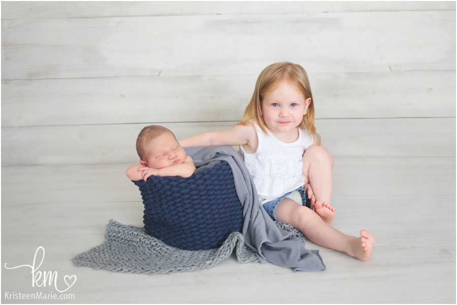 sibling picture - newborn baby and older sibling - sibling newborn pose