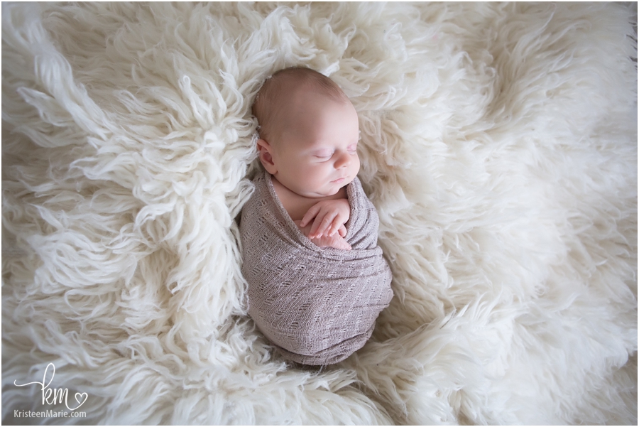 newborn baby photo with blankets