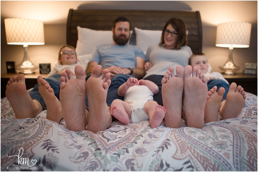 family's feet - baby, kids, mom and dad feet