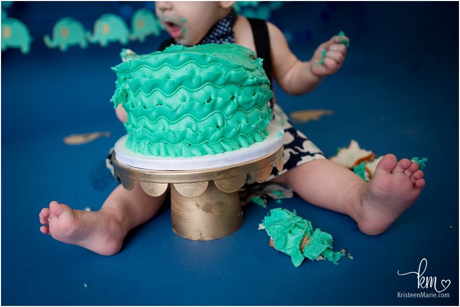 messy baby eating cake