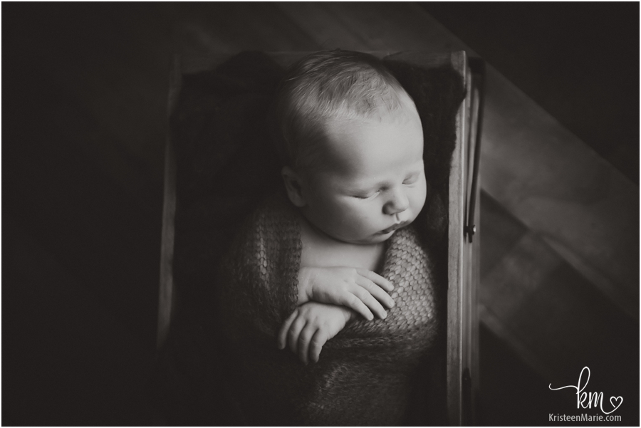 dramatic newborn photography image