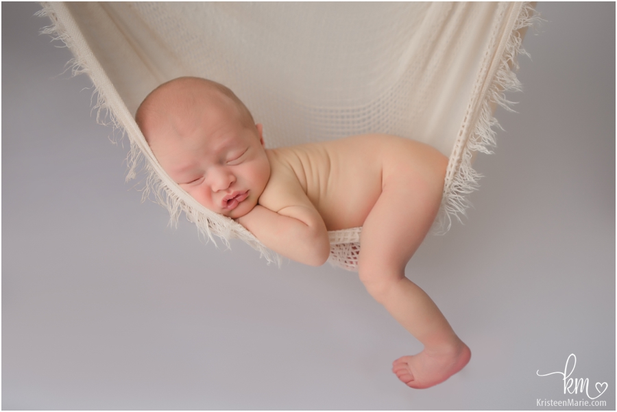 hanging newborn baby image