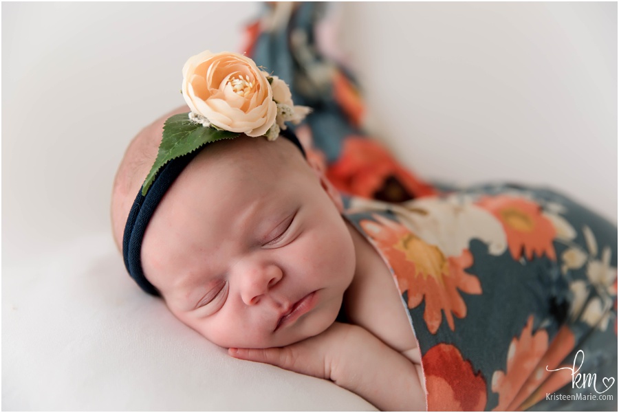 newborn baby in floral print