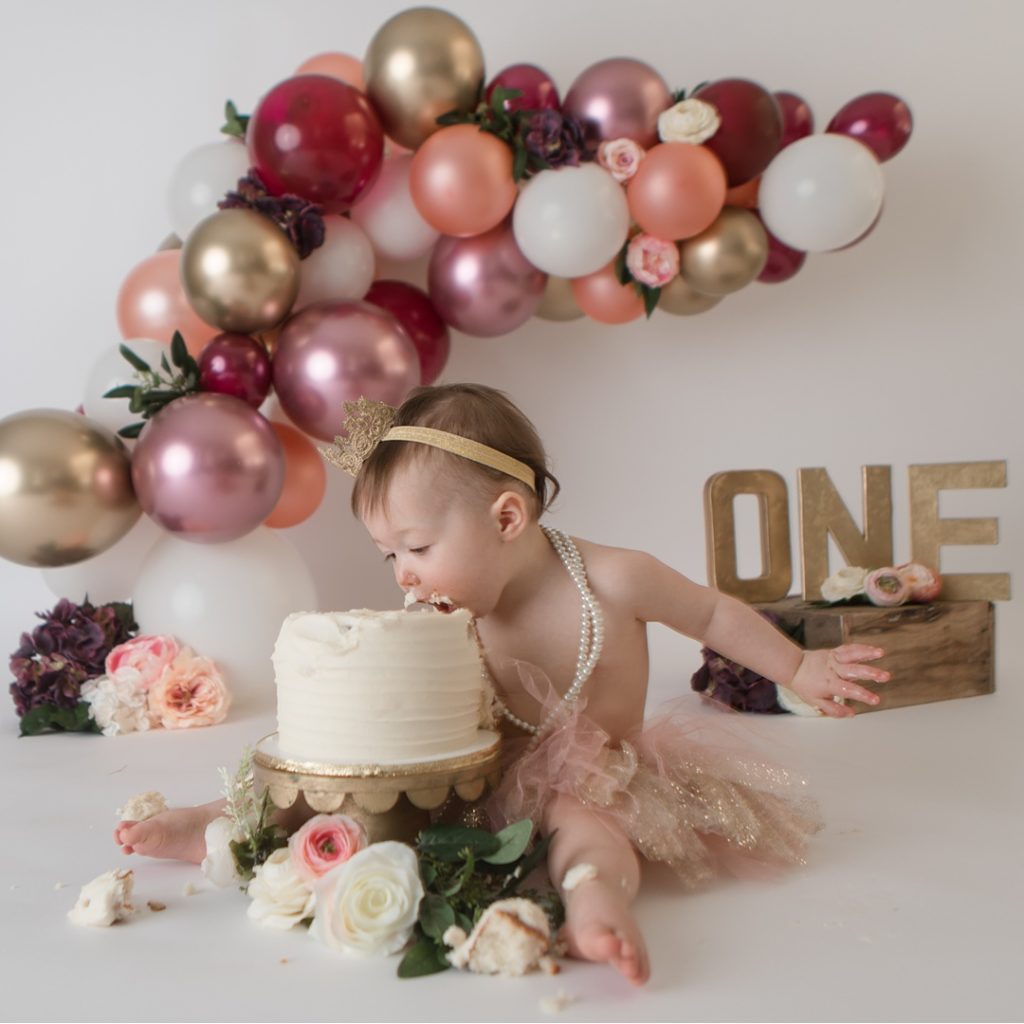 Burgundy and Gold Cake Smash with Balloon Arch · KristeenMarie Photography