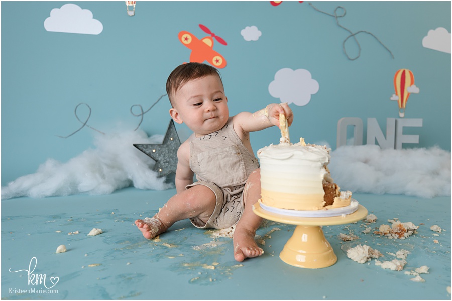 boy pulling cake topper