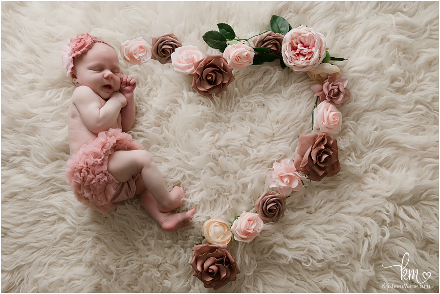 baby girl in heart flower