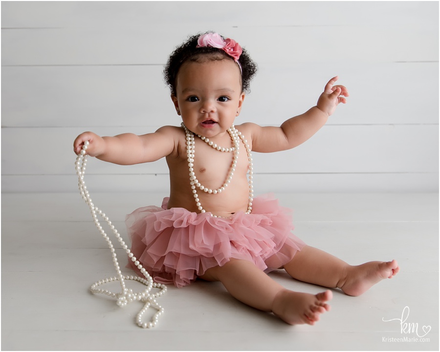 baby girl with pearls 