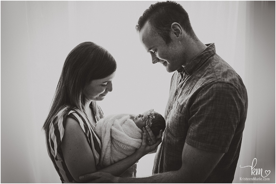 mom and dad with newborn baby - black and white