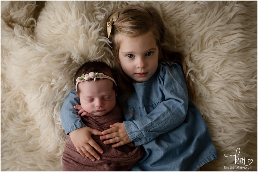 sisters - 2 year old and newborn