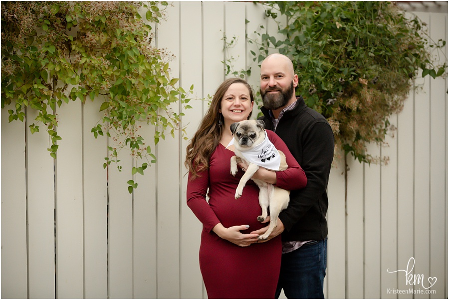 expecting couple with pup