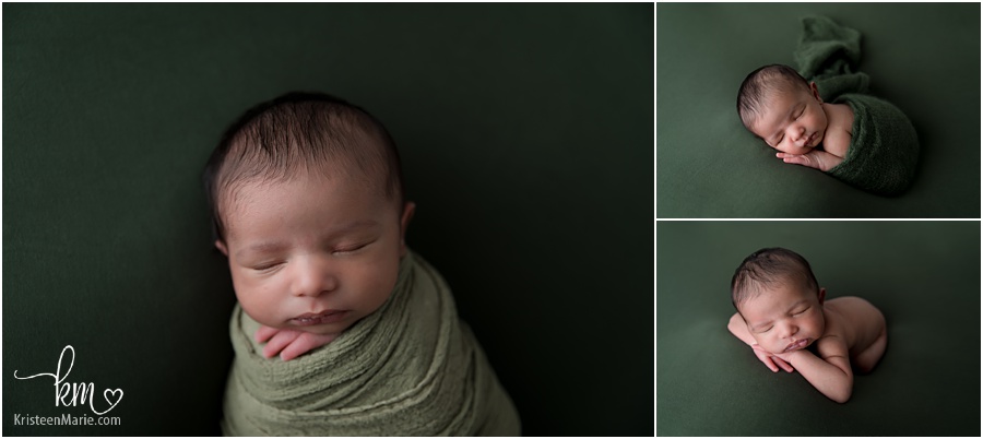 newborn baby boy on green