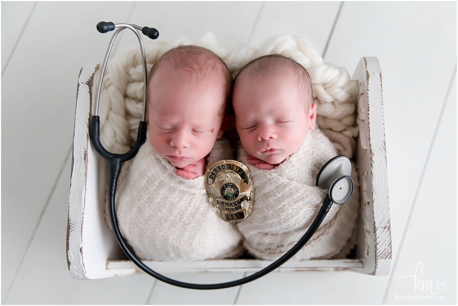 nurse and police man newborn picture with twin boys