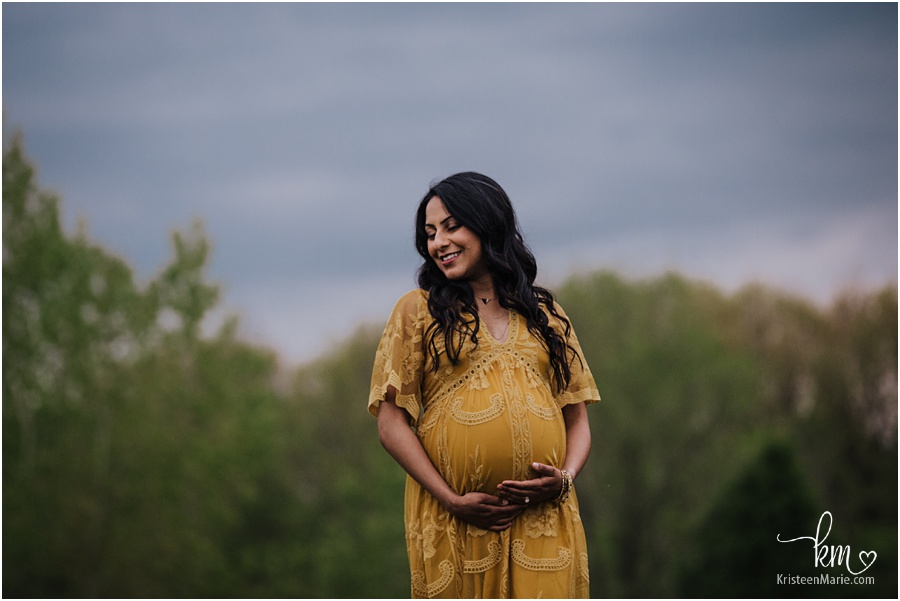 happy expecting mother during maternity session