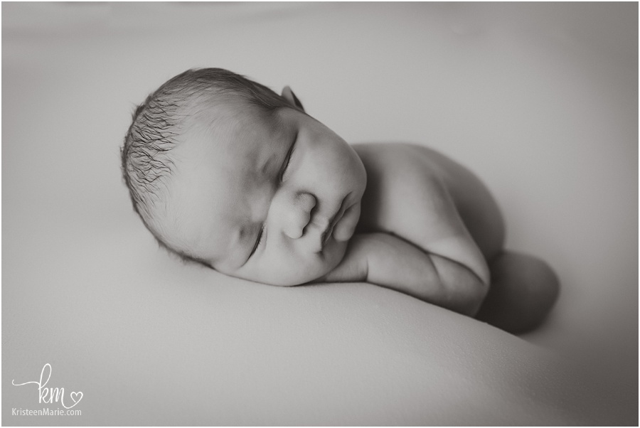 Indianapolis newborn photographer - black and white newborn picture of baby sleeping
