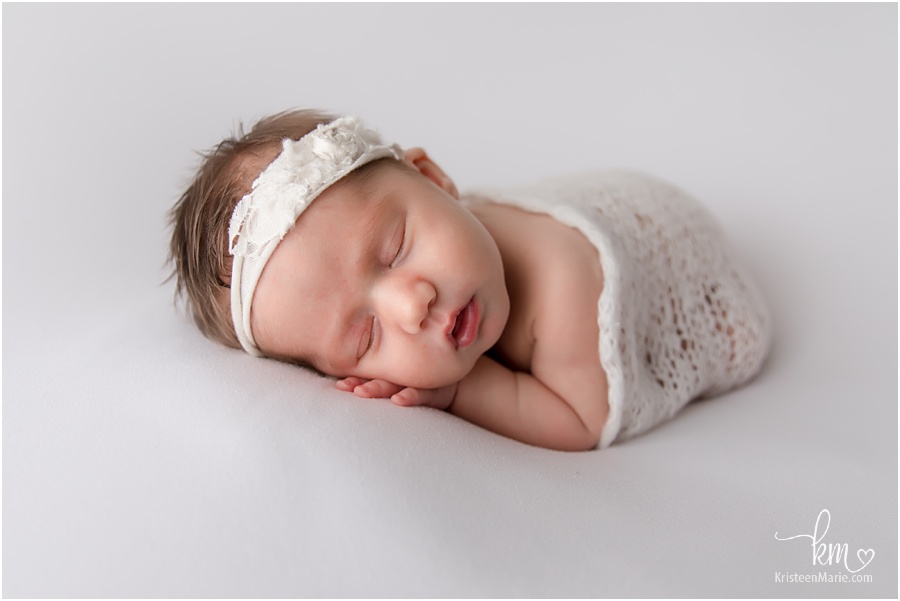 newborn girl in white
