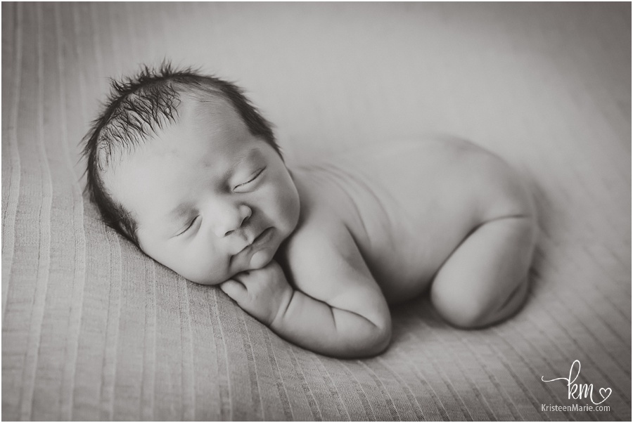newborn boy in black and white image