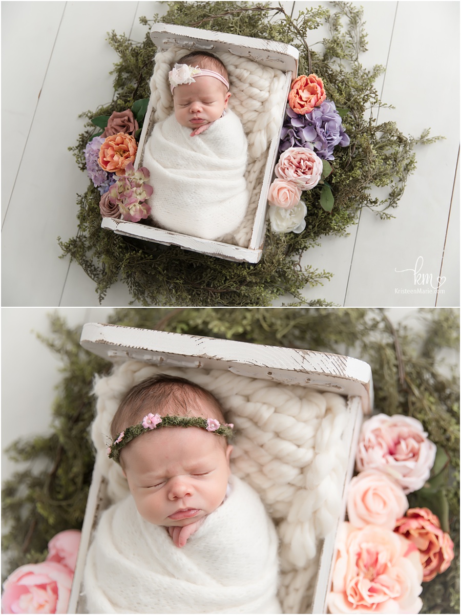 newborn girl with floral elements