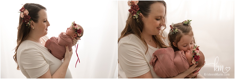 mom and newborn baby with matching floral crowns