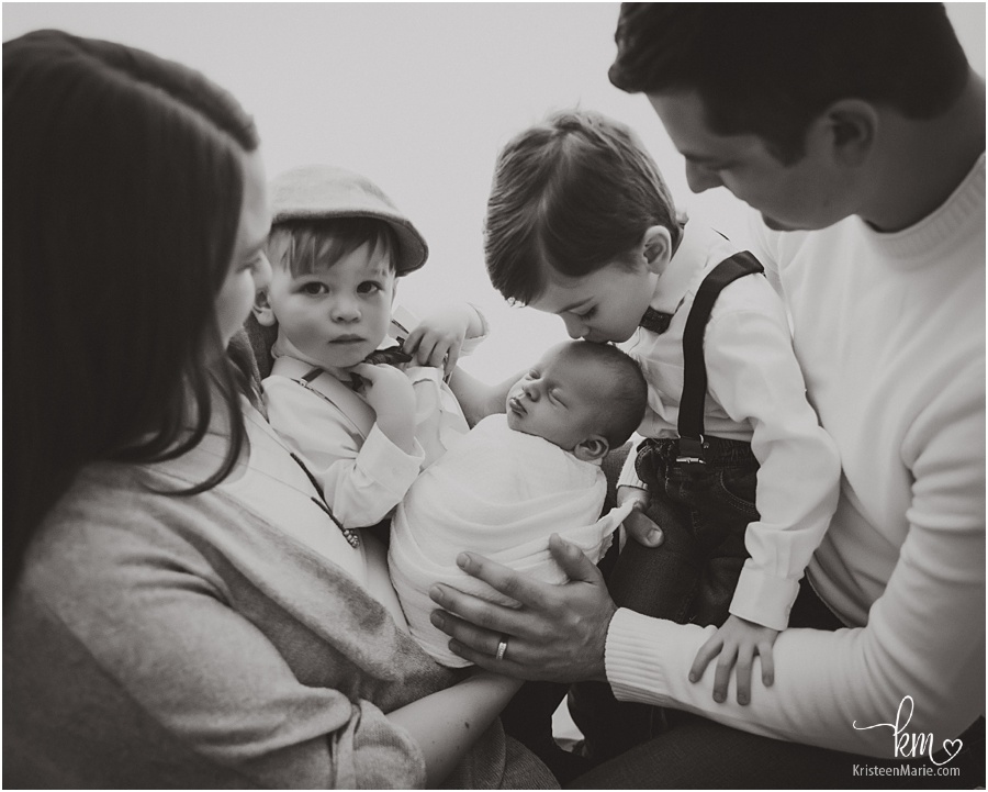 whole family with newborn boy - backlit
