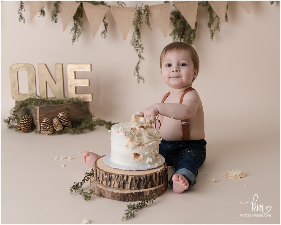 One year old eating cake