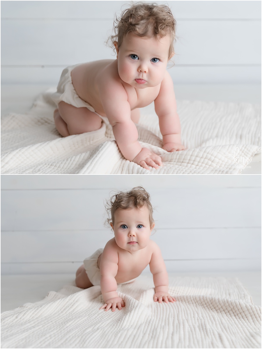 baby girl with rolls in white