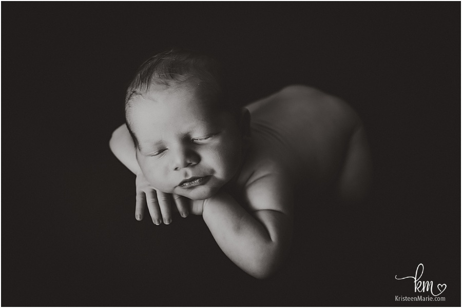 newborn boy in black and white